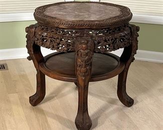 CHINESE SOAPSTONE CARVED TABLE  |  Round side table intricately carved and decorated with cherry blossoms, vines, flowers, etc. and having an inset stone top - h. 23 x dia. 26 in.