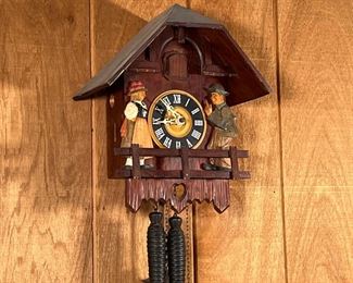 VINTAGE CUCKOO CLOCK  |  Wooden cuckoo clock with carved wood and painted figures - l. 12.5 x w. 7.5 x h. 14.5 in.
