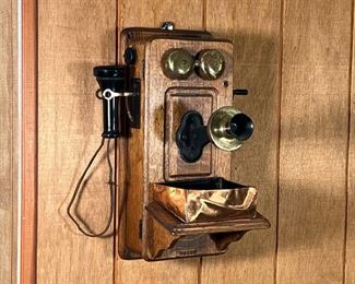 VINTAGE WALL PHONE  |  Kellogg wall mounted crank phone, tiger oak case numbered 2816H - l. 13.5 x w. 12.5 x h. 18 in.