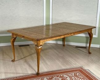 CUSHMAN EXTENSION DINING TABLE  |  Lightly colored wood extension table with a single leaf, on cabriole legs - l. 65 in. without leaf - overall l. 79 x w. 44 x h. 29.5. in. (with leaf)