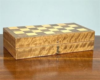 CARVED STONE CHESS SET  |  Travel chess set with a lacquered brass inlaid case folding open to reveal carved stone chess pieces, stamped "Made in Korea" - l. 14.25 x w. 7 x h. 3.5 in. (closed)