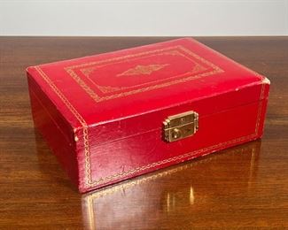 LEATHER BOUND JEWELRY BOX & CONTENTS  |  With internal folding tray, some keychains, trinkets, coins, patches, and a needlepoint matchbox - l. 10 x w. 7.5 x h. 3.5 in.