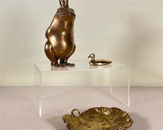 (3pc) MISC. BRASS TRINKETS  |  Three brass items including: a frog king waiting to be kissed; a duck; and a geranium leaf form catchall dish by Cambron - w. 3.5 x h. 6.5 in. (patient frog king)
