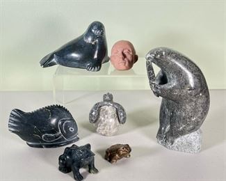 (7pc) CARVED STONE ANIMALS  |  Inuit stone and other figures, including a groundhog eating a leaf, seal, fish turtle, two frogs and a human head [cracked]; many are signed on bottom - h. 7 in. (ground hog)