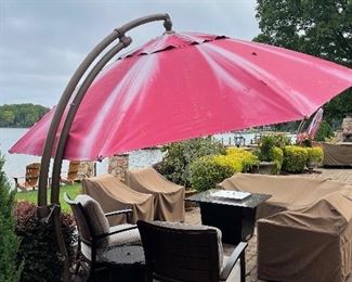 outdoor patio umbrella- cemented in 1 of 2.