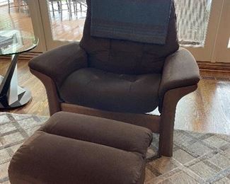 (2) Stressless brand recliners with storage ottomans   
