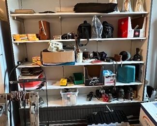 Tons of old cameras and a drill press