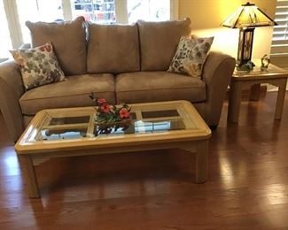 Excellent condition sofa with pillows.            Lovely glass top coffee table   