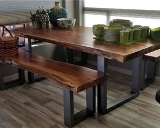 Beautiful wooden slab table with metal base and matching benches. Just gorgeous! Modern meets rustic.