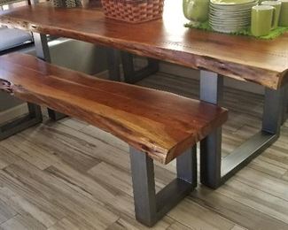 Beautiful wooden slab table with metal base and matching benches. Just gorgeous! Modern meets rustic.