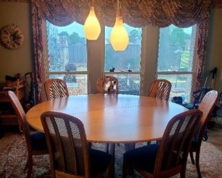 ONE OF A KIND
Round dining room table. Made of birch plywood
Approx 79" 
Seats 8. 
*8 chairs
The round birch plywood is on top of Italian marble table top that is approx 60"