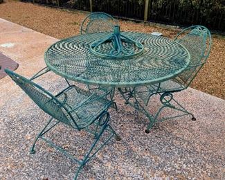 Another wrought-iron table and chairs