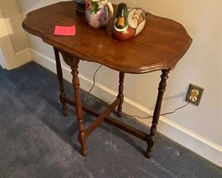#34	oval wood table with 4 brace legs 28x18x28	 $65.00 			
