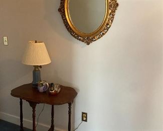 #34	oval wood table with 4 brace legs 28x18x28	 $65.00 			
mirror is plastic 