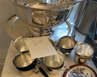 #46	misc.	silver plate punch bowl, laddle 12 cups and tray 	 $50.00 			
