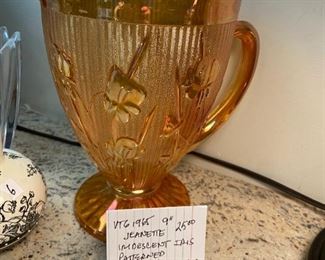 #48	China	janette 9" irredescent iris patterned carnival glass pitcher 	 $25.00 			
