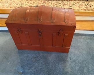 #32	red painted camel back chest with tray 	 $75.00 			
