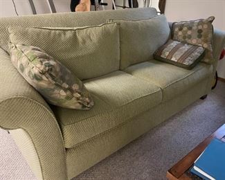 beautiful upholstered sage-green sofa