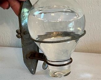 Heat activated glass fire grenade c. 1920's w/original wall bracket
