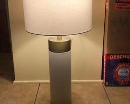 $140 USD      Set of Two Harlow Shagreen Cylinder Table Lamps 1 Ivory Grey & 1 White VR49-10875     Description : Boasting a fabric drum shade atop a column base with a faux shagreen facade, the Harlow radiates sophistication. This Regina Andrew original is an example of craftsmanship that beautifies while it illuminates.

Item Number : 49-10875

Category : Table Lamps

Brand : None

Attributes

Condition Desc. : These lamps are in like new condition. There are only MINOR superficial signs of wear. Please refer to photos for a more detailed look at condition. We make every attempt to list and photograph any defects or signs of wear that are significant to this sale.
Location : Portland, OR     https://goodbyhello.com/products/set-of-two-harlow-shagreen-cylinder-table-lamps-1-ivory-grey-1-white?_pos=13&_sid=cbcb4d97a&_ss=r