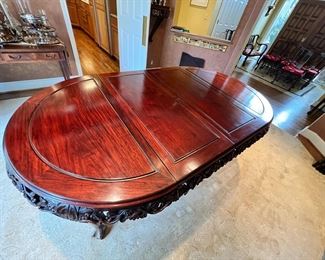 $3750 USD     Gorgeous Vintage Chinese Carved Rosewood Dining Table PD138-12    Description:  Gorgeous Chinese Antique Rosewood Dining Table.  It is made from solid rosewood with traditional Chinese Ming dynasty style design and traditional Chinese folks art carving works of Grapes and grape vine all around the table. It is very heavy and sturdy, very smooth to touch, full of patina. The table has two extra 18" extension leaves (pictured) that give the option to extend the table from 46" to 82".  

COMPANION SET OF 8 CHAIRS AND A LARGE HUTCH AVAILABLE FOR SALE AS WELL.  PLEASE CONTACT US FOR MORE INFORMATION.

Dimensions: 82 x 46 x 30"H 

Condition: This table has been extremely well cared for and has always been kept under a a custom table pad. Chairs are in excellent condition as well.  

Location: Local pick up Lake Oswego, OR 97034.  Shipper suggestions available upon request.  Located on the main floor with direct outdoor access through double doors.      https://goodbyhello.com/p