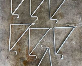 Seven 12-inch shelf brackets with closet pole brackets
