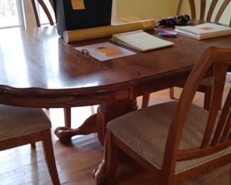 Beautiful oak table and four upholstered chairs chairs are very heavy duty and large