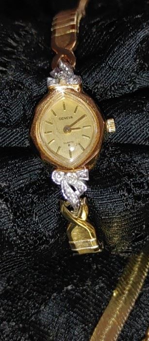 Geneva ladies gold filled watch with two little diamonds