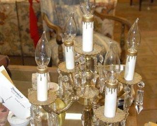 Matched pair of brass candelabras with extra nice crystals. Both working.