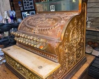 ornate brass cash register by National Cash Register Co.