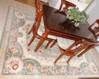Dining room table is not for sale, however, the area rug is for sale.