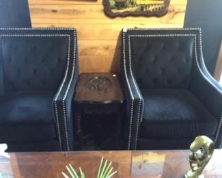 Black velvet chairs.