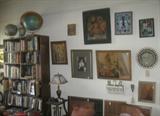Wall of Religious Art work Books and Globes
