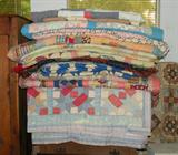 Stack handmade quilts