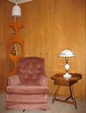 Rowe Mauve Swivel-Rocker Easy Chair Shownw with art deco corner cabinet, Heywood-Wakefield Table with Metal Stenciled Lamp