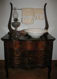 Antique Oak Serpentine Front Wash Stand W/Towel Harp. Shown with Antique Oil Lamp And White Ironstone Wash Basin