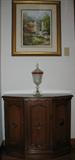 Small Oak Finish Console Cabinet with Indiana Glass "Diamond Point" covered Compote with ruby trim. Framed Garden Print