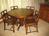 Antique Round Oak Table w/Round Column Base and Empire Legs Shown with a Set 4 English Oak Side Chairs