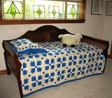 Mahogany Sleigh - Day Bed show wigh Blue and White hand quilted quilt & pillow sham. 2 Pair Antique Stain Glass Windows