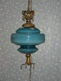 One of a pair Hanging Blue Cased Glass Lamps with Crystal Prisms