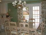 Veiw of Breakfast Room with French Doors to pool area. Photos show white washed Solid wood Table & 6 Side Chairs