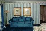 Centruy Custom Blue Upholstery Camel Back 3-Cushion Sofa show with Crystal Floor Lamp and a pair Bontanical Framed Prints