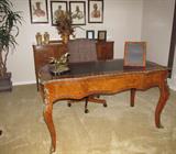 Louis XV French Style Bureau Plat Desk w / Leather Top and Brass Ormolu Trim
Louis XV Style Bureau Plat is hand crafted in solis wood and veneered in Mahogany and Kingswood with a classic design. It features three drawers (center w/lock) and a black leather inset top with embossed gold leaf design. With heavy ormolu brass adds to the quality of this piece. Measures; 32"H x 58"W x 30"D