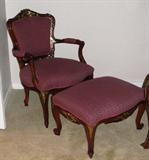 French inspired arm chair with ottoman. Brocade Upholstered with a ornate Cherry frame with heavy gold gilt set on Cabriole legs