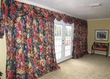 French Doors with custom made draperies off Family/living room to Pool & Patio Area