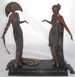 "TWO VAMPS" by Erte' deliciously reunites "La Pretensieuse" and "Seductress" intoxicating beauties first seen in Erte's 1929 "Folies Bergeres" of Paris. In Erte's own words: "Pretension often preceeds Seduction." These two are putting on the Ritz! Each Figure is adorned in sumptuous gold leaf with deco motifs inspired by all the ancient world. As only Erte' can conjure. Bronze Sculpture from the Grand Master's fabled Treasures in Bronze Sculpture Collection. Originally sold exclusively and purchased from Dyansen Galleries in Maui. {19.5" H}