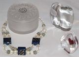 Lalique "Dahlia" 3 3/8" Powder Box surounded by a faux Satin Glass Beads and Square Hand Painted Ceramic Bead Necklace, A Baccarat Free Form solid Crystal Elephant and a artist signed and numbered Crystal "red Heart" Sculptured Paperweight.