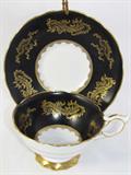 Porcelain Cup and Saucer with Black Boarder and Gold Trim