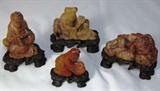 a Set of Oriental Netsuke Figurines on stands