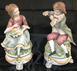 Pair Porcelain Bisque 8 ½” Figurines:  Girl with Flowers & Boy with Flute